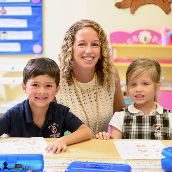 Teacher with two students