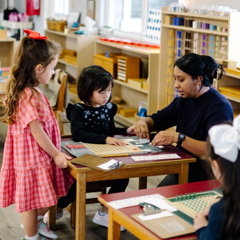Community Montessori School Students at a desk