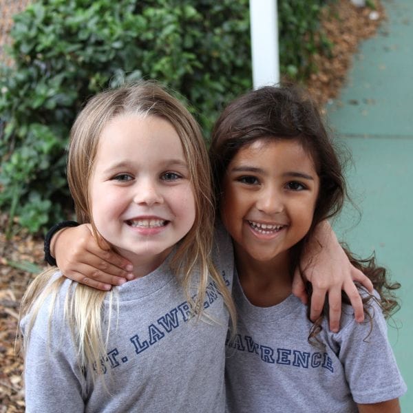 Two students smiling for photo