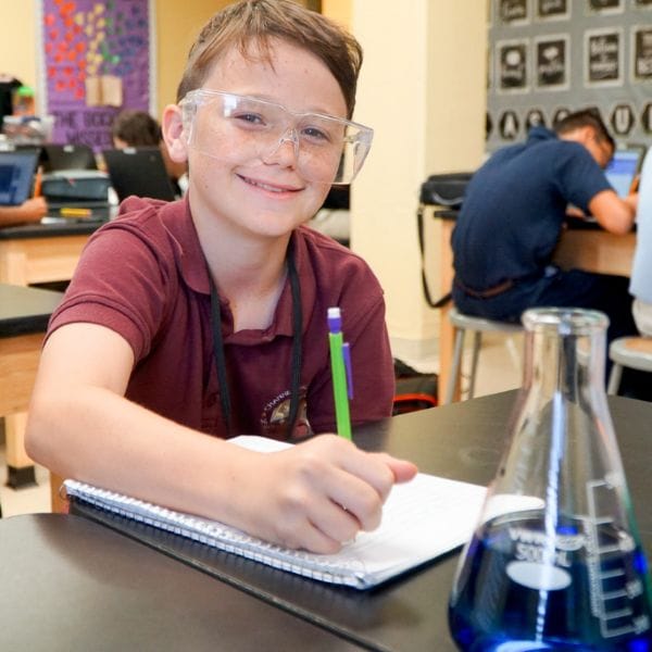 Student seated at desk in science class