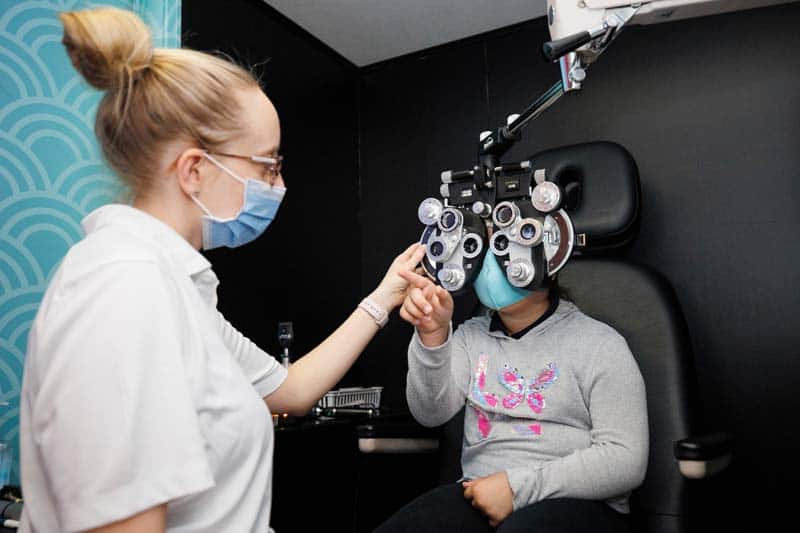 Dr. Zaleski performing eye exam