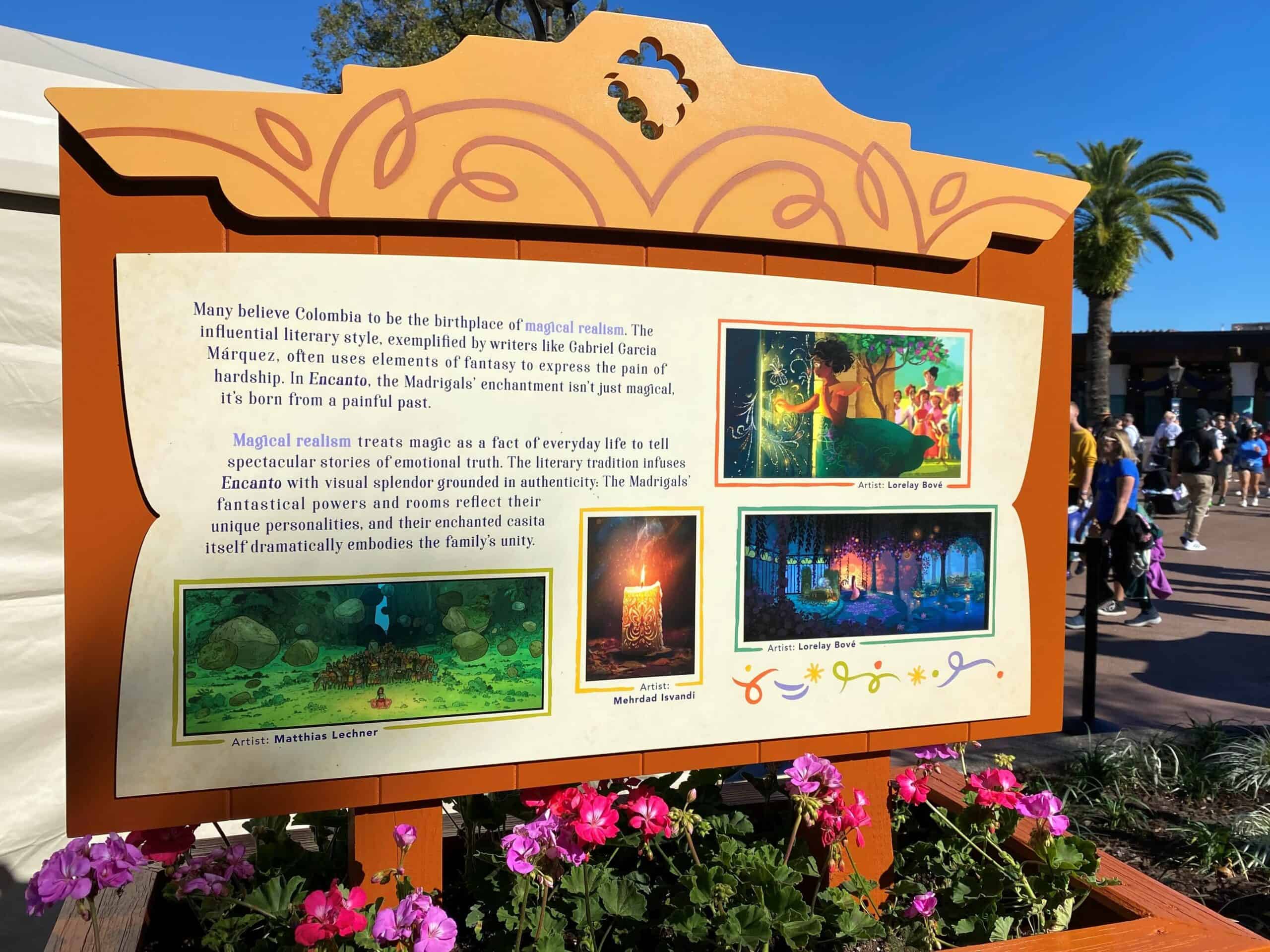 Encanto Concept Art and Info at Epcot Art Festival 2 is on display on horizontal signs inside flower boxes, with bright bold colors