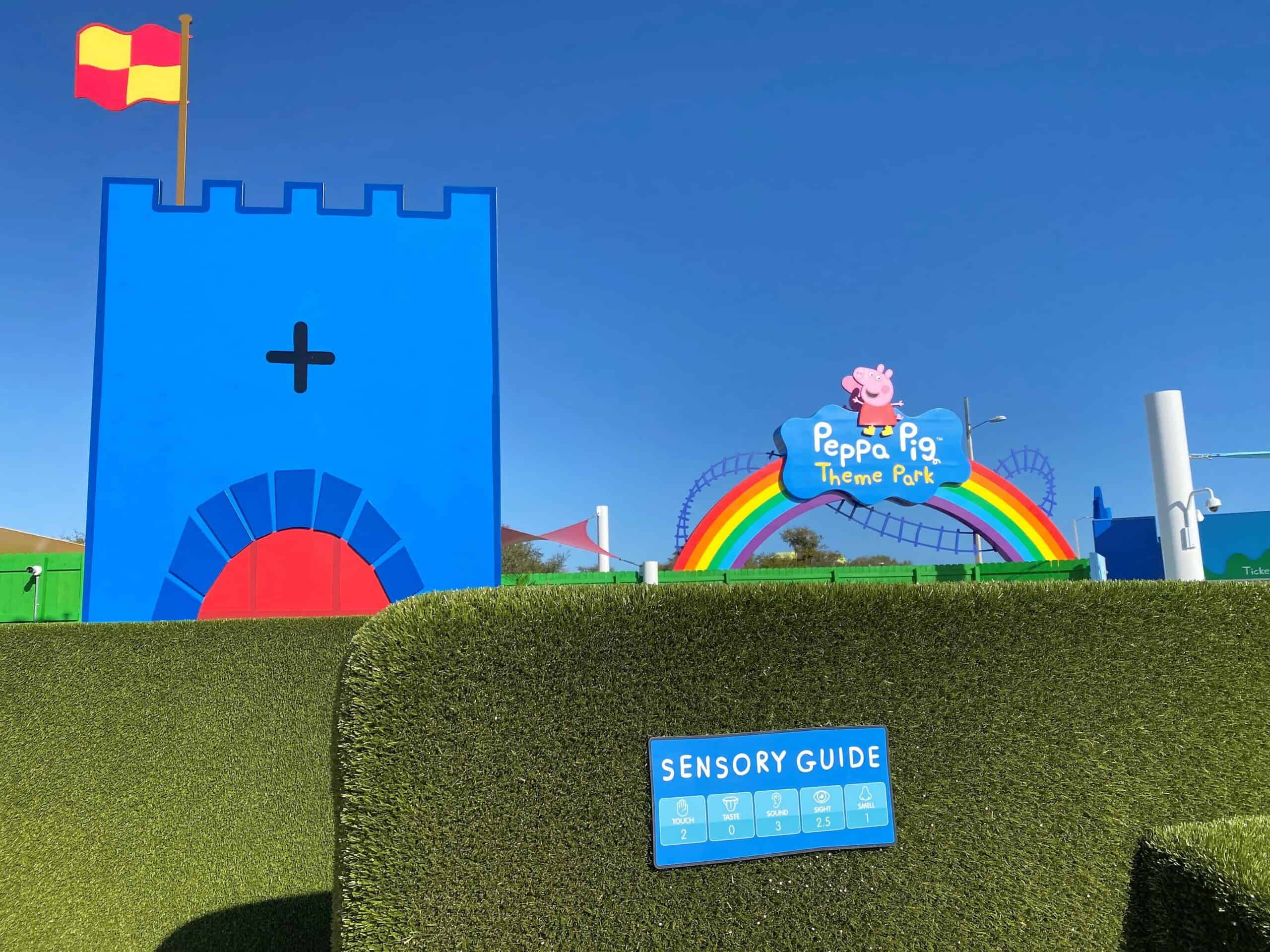 Sensory Guides for Autism friendly experiences at Peppa Pig Theme Park Florida is attached to a green hedge at the entrance of a simple maze