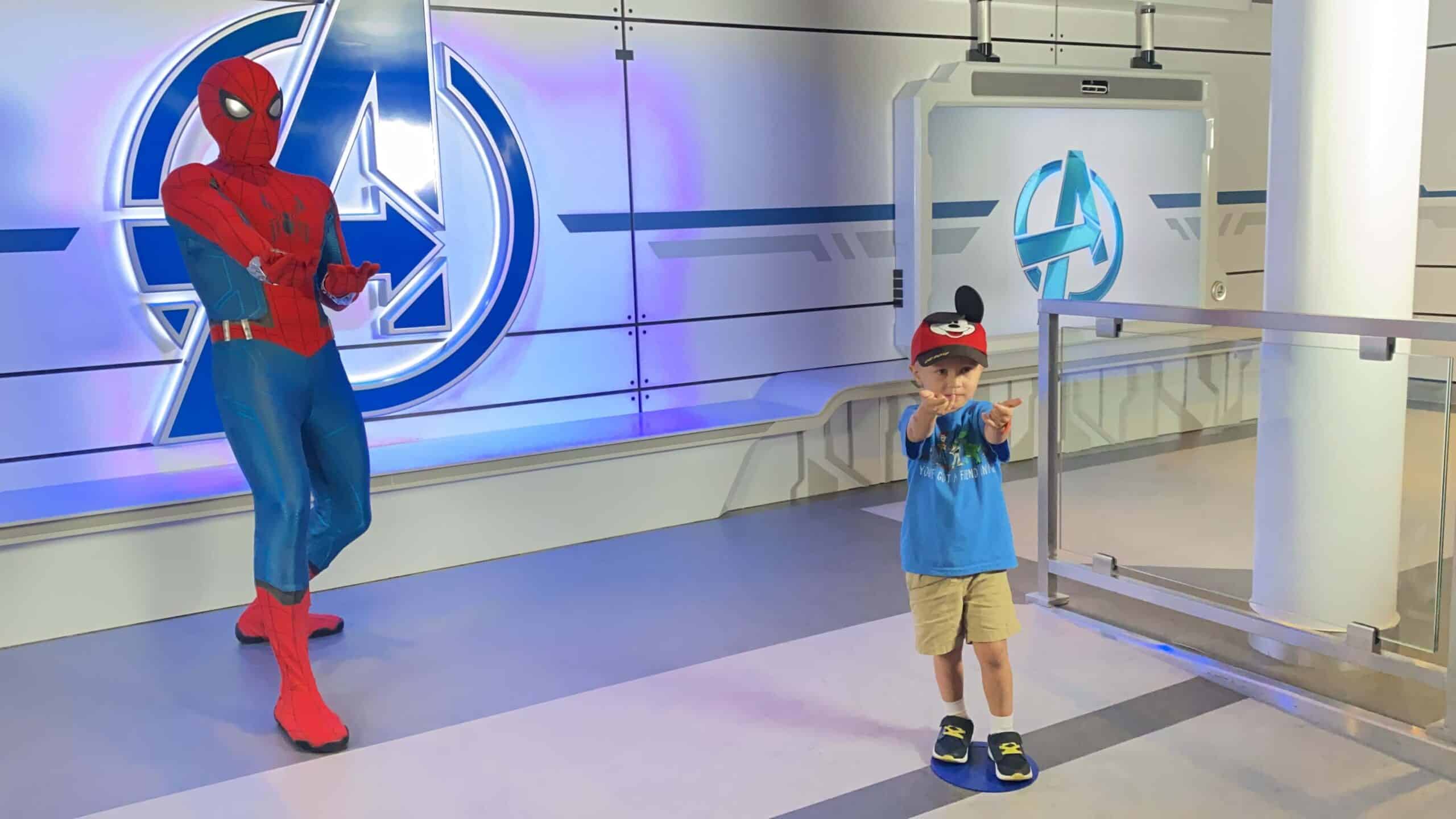 Spider-Man Character Greeting on Disney Wish, Spider-Man poses with four year old boy in an Avengers themed room