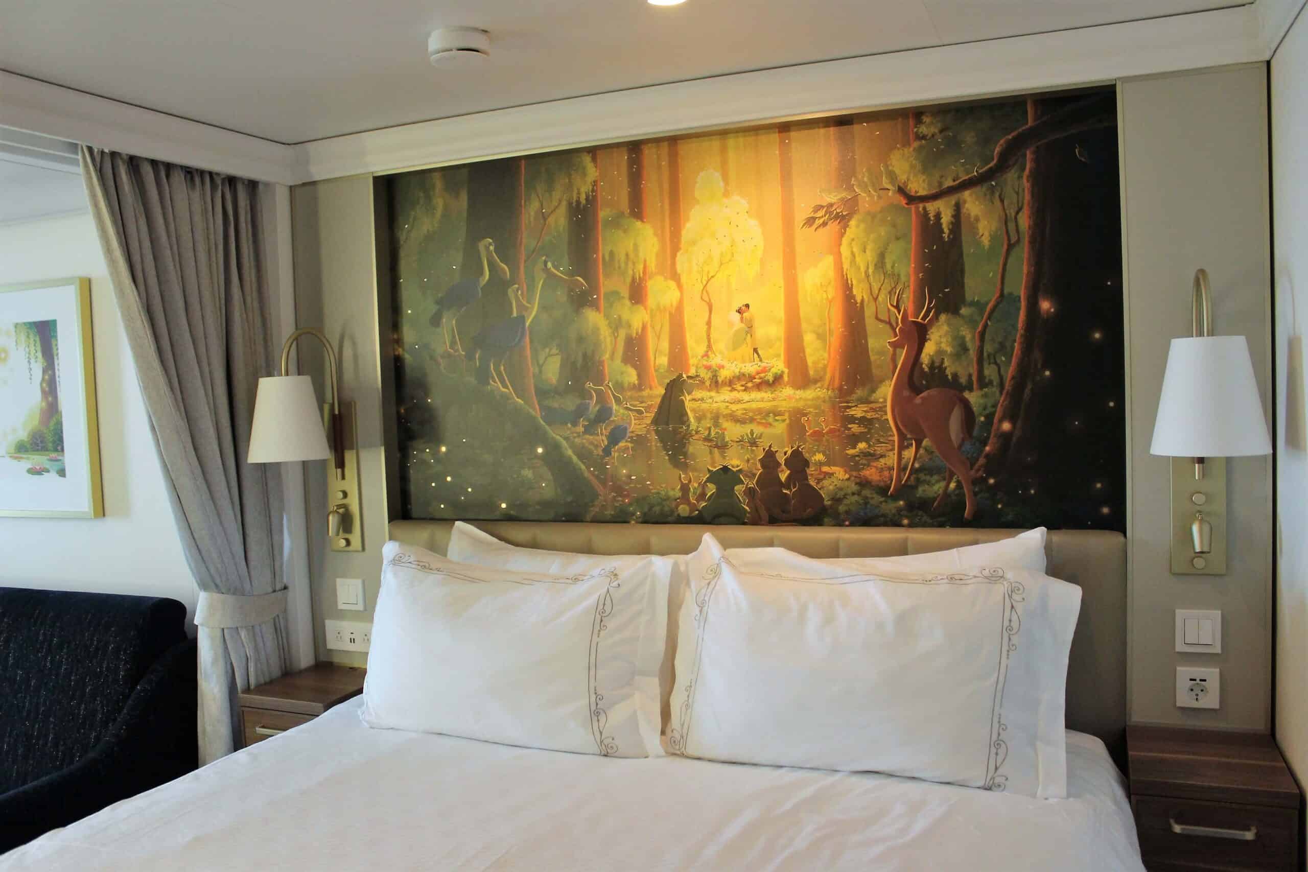 Tiana Themed Deluxe Family Stateroom with Verandah on Disney Wish with a scene from the movie Princess and the Frog as art behind the headboard of a bed with all white sheets