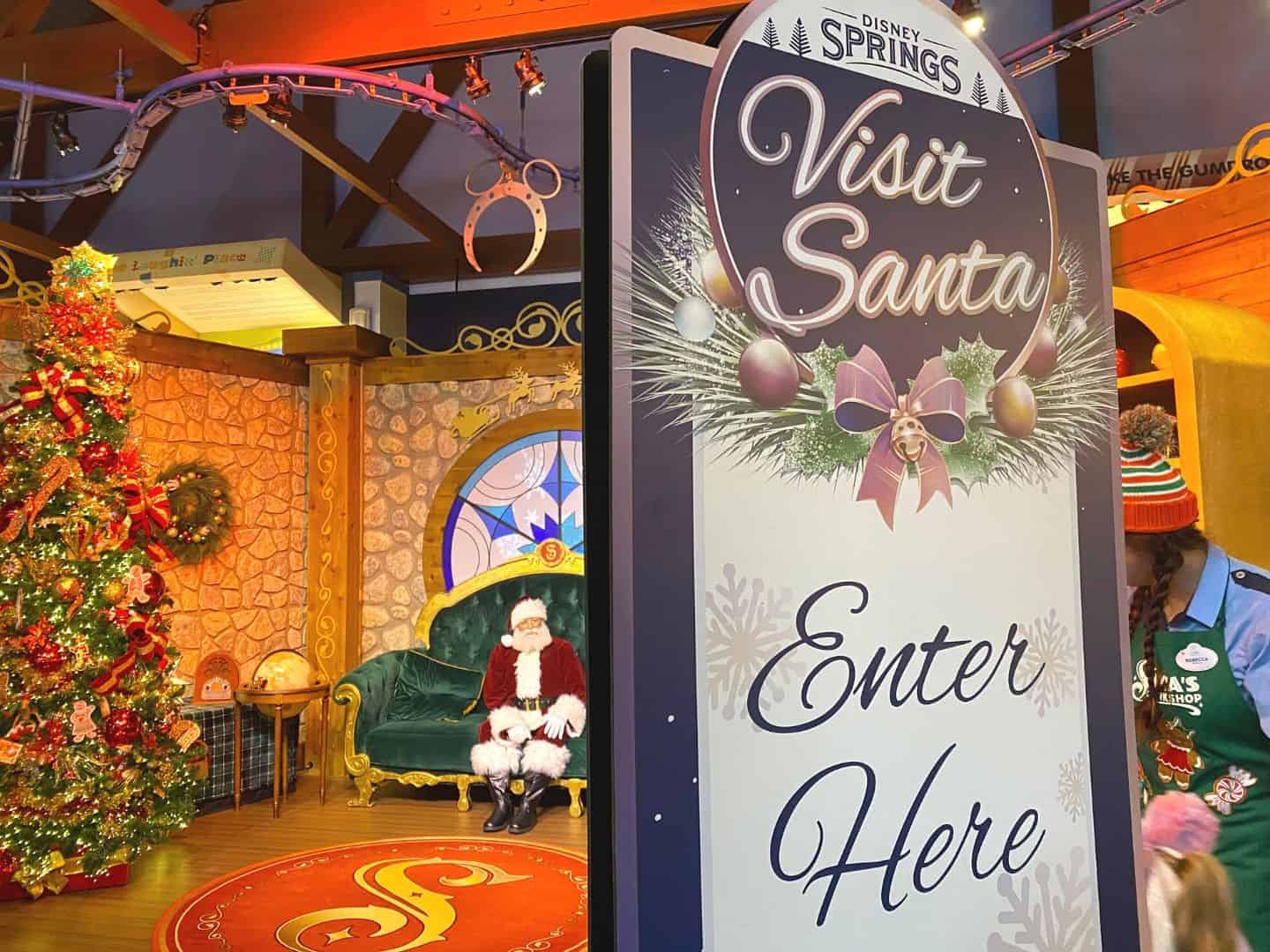 Santa waits to greet guests at Once Upon a Toy at Disney Springs