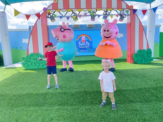 two young boys meet Peppa Pig characters at Peppa Pig Theme Park