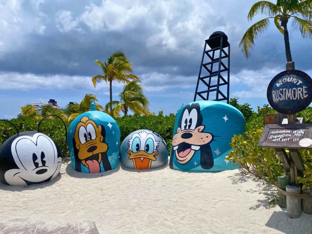mount rustmore at disney's castaway cay private island are old metal bouys painted with disney characters and given a special blue color makeover for the 25th anniversary