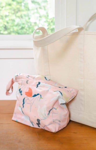 the Wet-Dry Bag from Loulou Lollipop filled with items