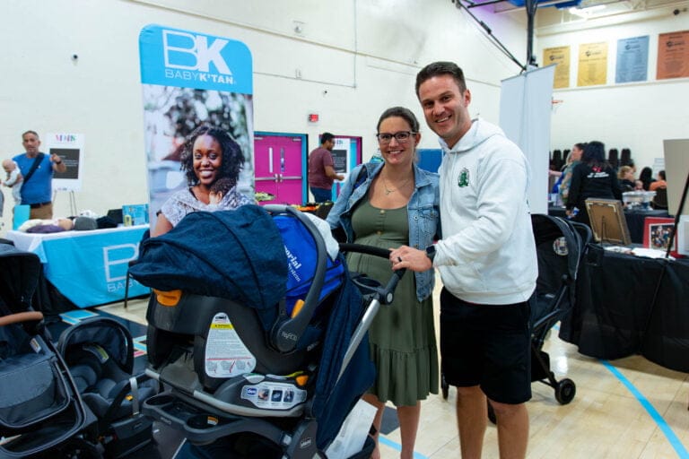 Mother of All Baby Showers Tampa New parents test out new stroller