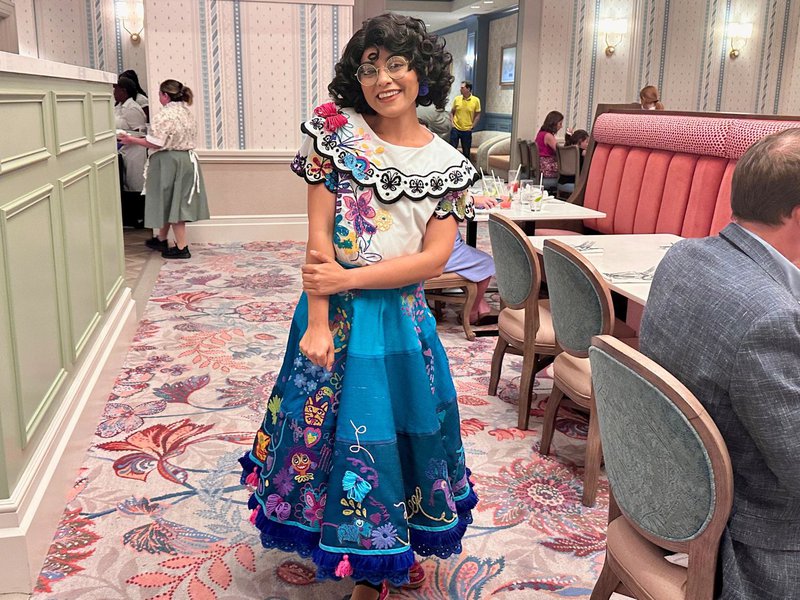 Mirabel poses for a picture at 1900 Park Fare Character Dinner