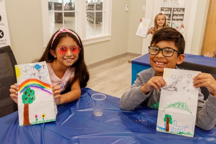 Library Summer Reading Program kids showing their artwork creations