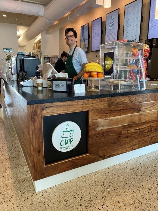 CUP Coffee Uniting People barista welcomes you
