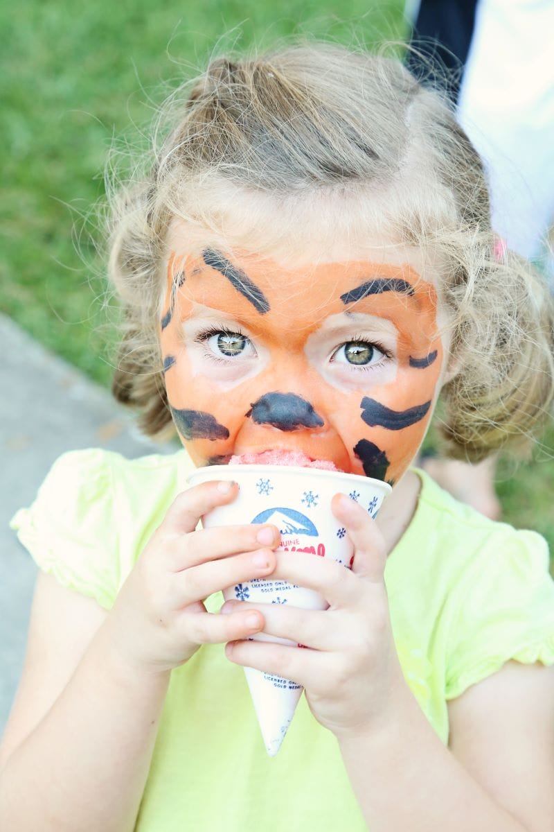 kid eating a snow cone at the Watermelon Swim Fall Festival
