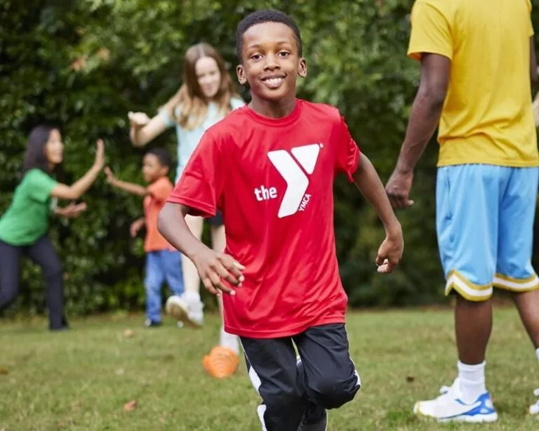 Boy running is a member of the Tampa YMCA Thriver’s Club - Cancer Survivor Program for Kids