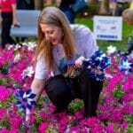 pediatric trauma care at TGH Muma Children's Hospital woman placing pinwheels for child abuse