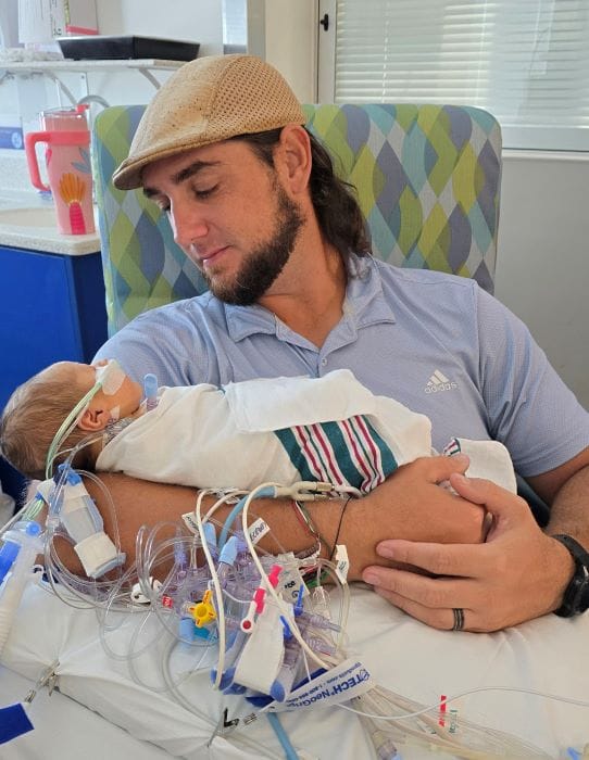 Baby Adrian with his Dad following pediatric heart surgery from cardiologists at St. Joseph's Children's Hospital