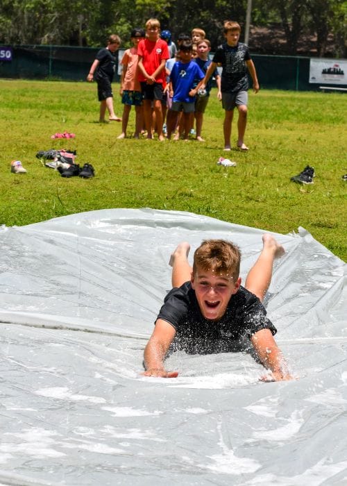 Screen-Free Summer Camp water slide