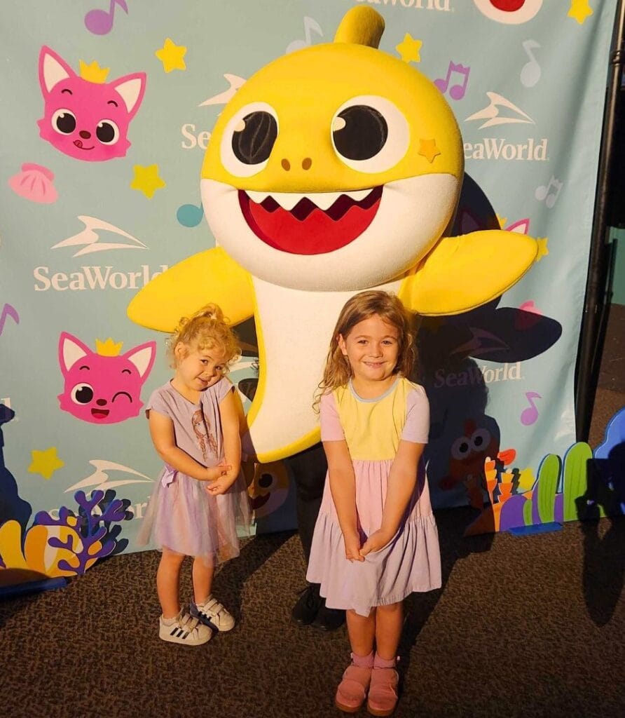 Baby Shark Character Greeting at SeaWorld Orlando two daughters - image by Zoe Joiner