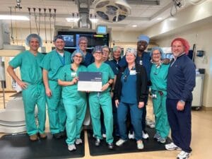 Doctors showing the certificate for the all-new game-changing infant cardiac stent