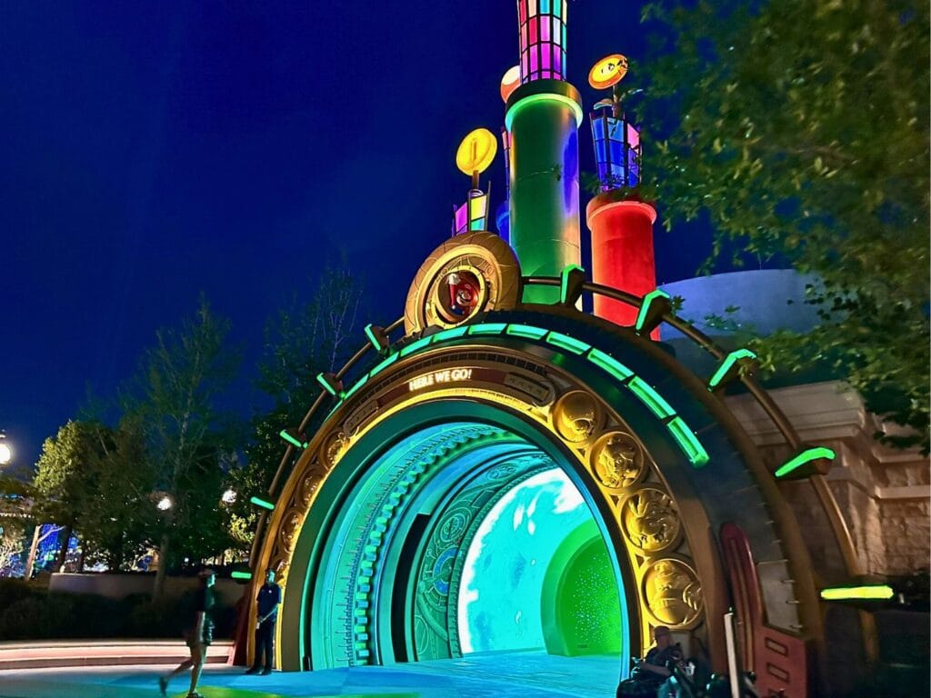 Guest Walks Through Super Nintendo World Portal at Night - image by Dani Meyering