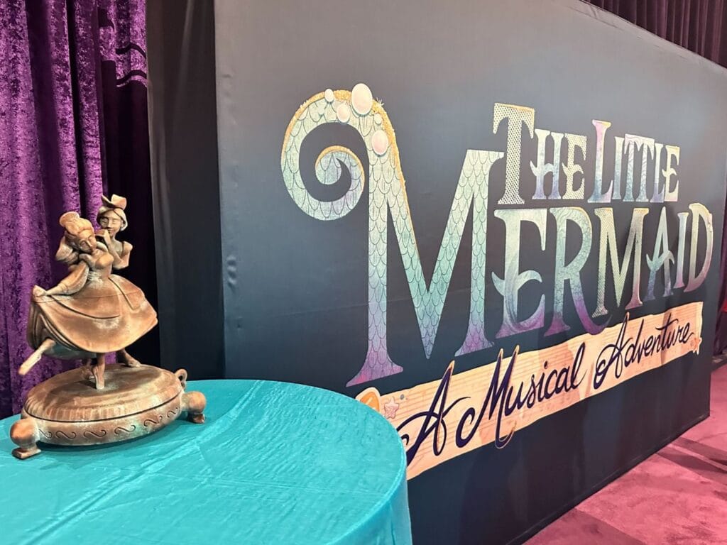 The Little Mermaid A Musical Adventure banner with statue prop - image by Dani Meyering