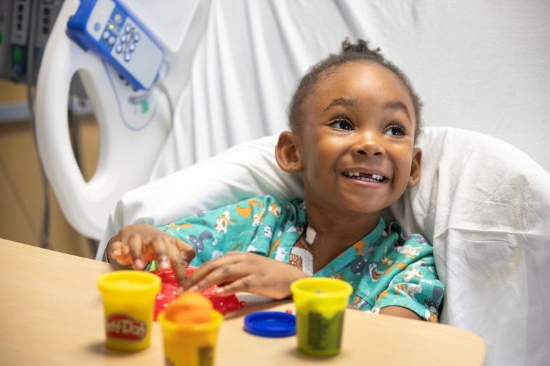 aliyah looking happy in the hospital after she was cured of sickle cell disease at Johns Hopkins All Children's Hospital