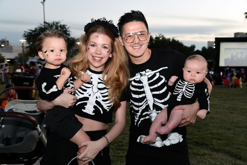 family wearing skeleton Halloween costumes at the riverwalk trick or treat