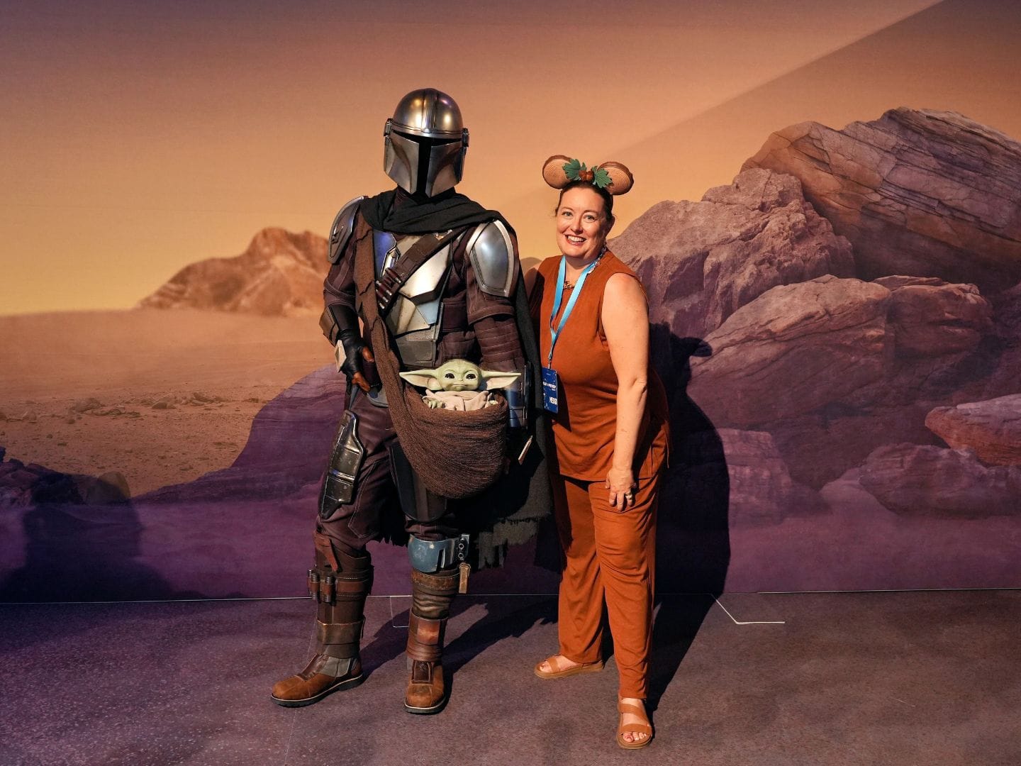Dani Meyering poses with Mandalalorian and Grogu characters at Disney media event coming soon Walt Disney World - image from Disney PhotoPass