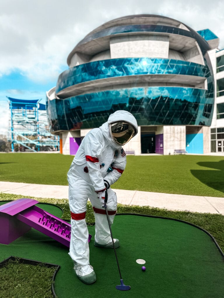 PHOTO - Moonbase Mike playing SciLinx Mini-Golf at MOSI - credit MOSI