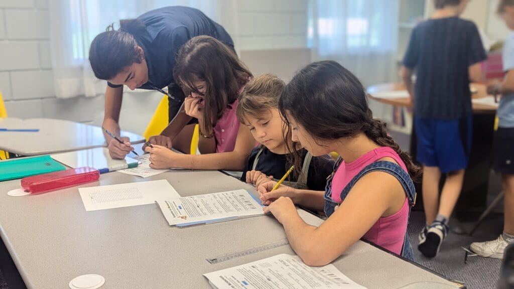 Older student working with younger students