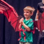 a boy wearing dragon wings during Marcia P. Hoffman school of the arts Winter classes