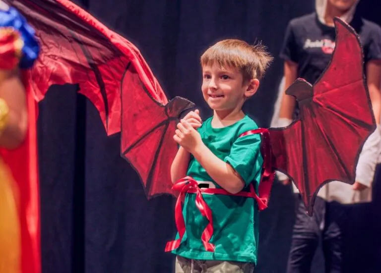 a boy wearing dragon wings during Marcia P. Hoffman school of the arts Winter classes