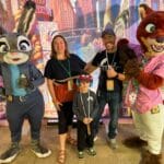 Editor Dani Meyering and family pose with characters from Zootopia Better Zoogether at Animal Kingdom - image from Dani Meyering