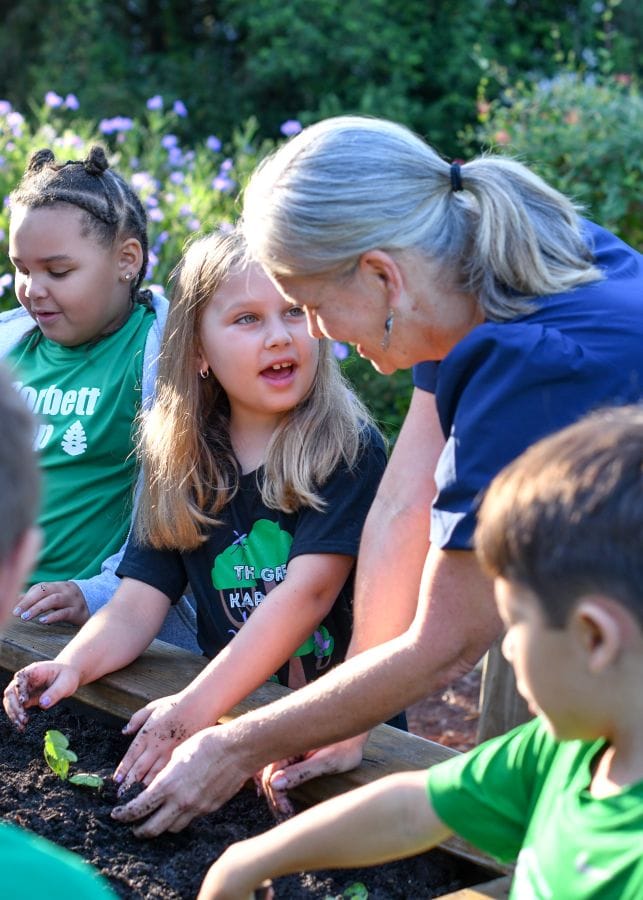 Corbett Prep students gardening with teacher