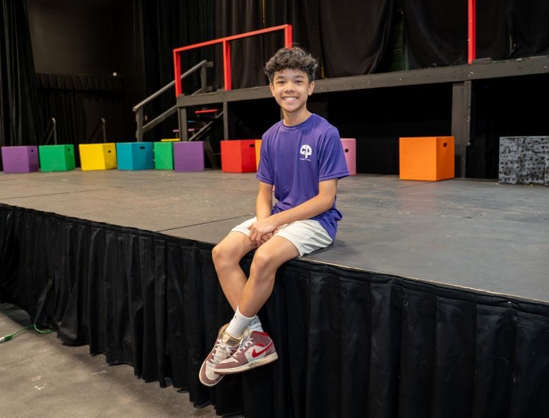 Jacob Pham sitting on stage