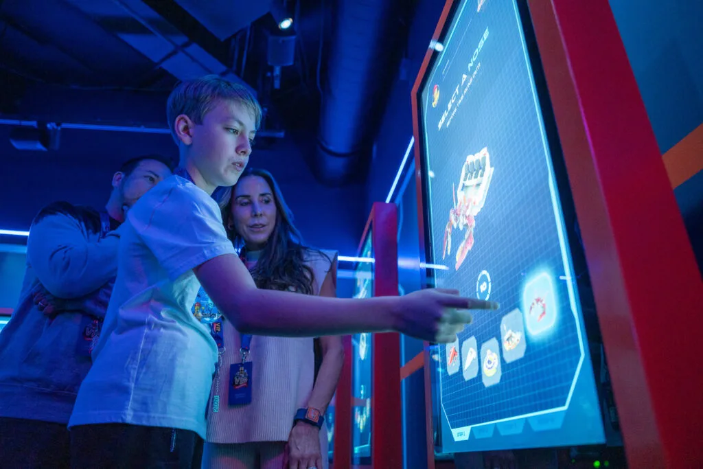 Howie Dorough's son, Holden, customizes their Galacticoaster ride vehicle.