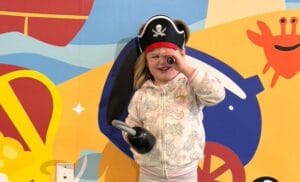 Girl dressed as pirate at Glazer Children's Museum for Pirate Invasion