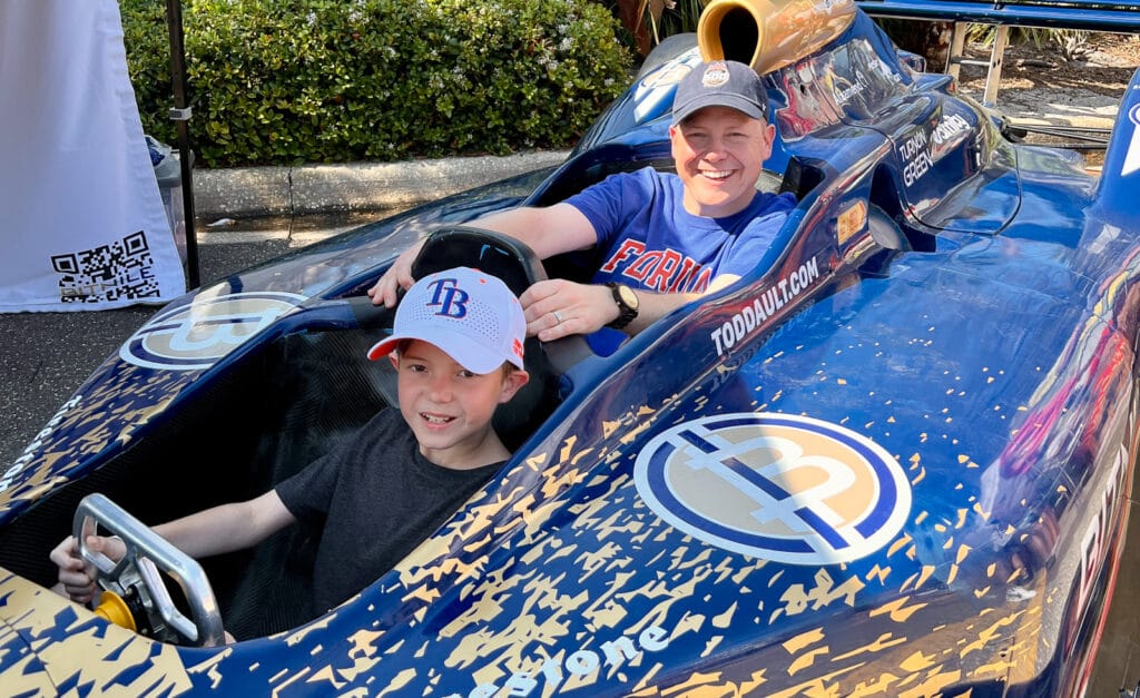 Grayson Kamm and his son in car at the Firestone Grand Prix of St. Petersburg.