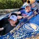 Grayson Kamm and his son in car at the Firestone Grand Prix of St. Petersburg.