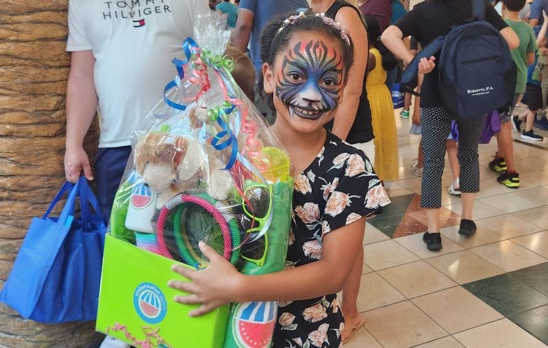 Back to School Fair prize winner with painted face