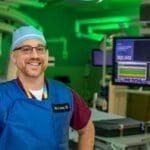 An image of a man standing inside a cath lab at John's Hopkins All Children's Hospital