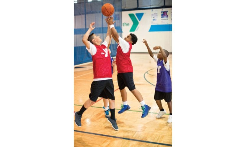 Boys playing basketball at YMCA