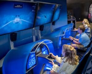 Design and fly your own supersonic fighter jet at the Above and Beyond exhibit at MOSI.