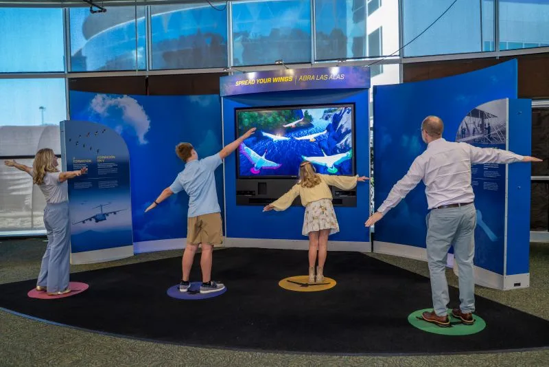 Flying like a bird in interactive exhibit of Above and Beyond at MOSI.