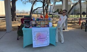A young girl showing off her booth at Tampa Bay Kids Market