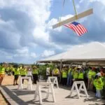 The American Flag is lifted with the final beam for the new Johns Hopkins All Children's Hospital Wesley Chapel