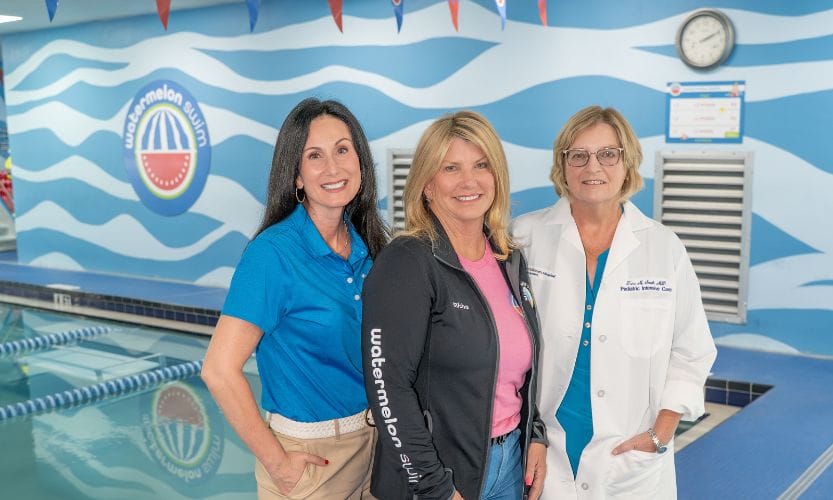 Nora Gunn, Micha Seal, and Dr. Tara Smith post for a picture at Watermelon Swim