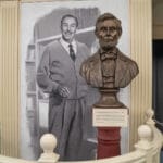Painting of Walt Disney and a bust of Abraham Lincoln. Learn about American History at Liberty Square at Disney's Magic Kingdom