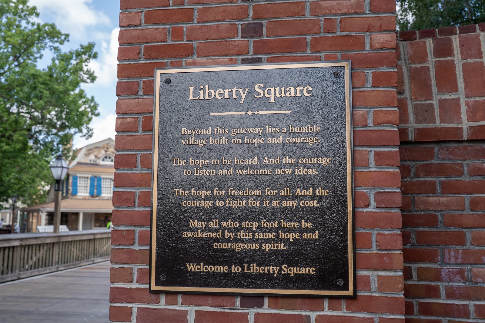 Entrance to Liberty Square at Magic Kingdom with bridge in background.